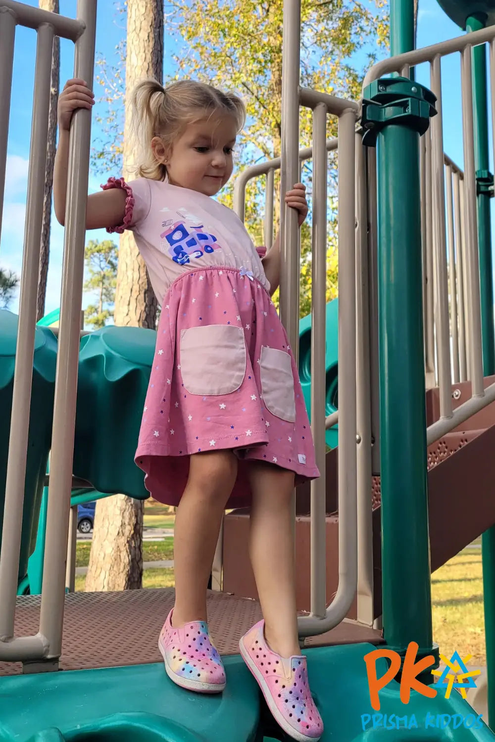 Young girl posing with a joyful expression. Wearing train dress design