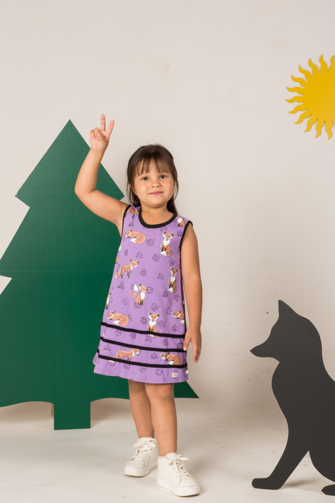Sleeveless lilac purple tent dress for girls featuring a geometric fox and gemstone print, built-in side pockets, and a neat keyhole back button.