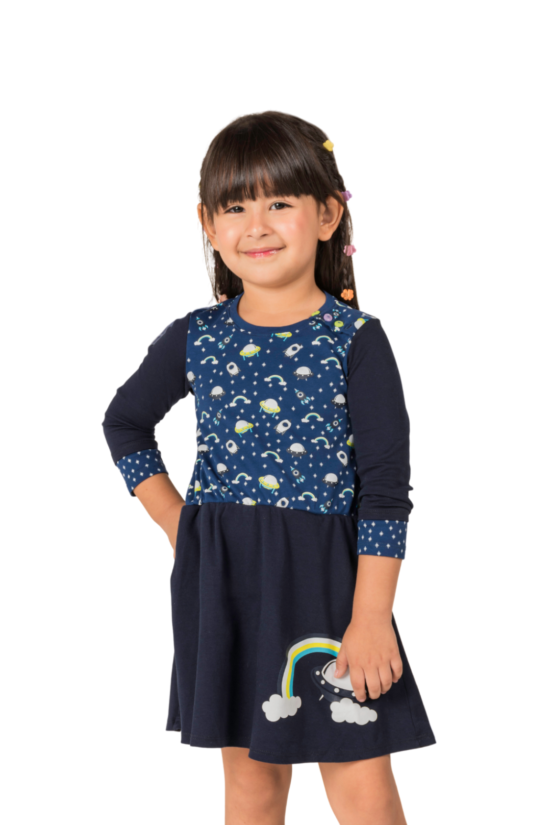 Deep blue girl's dress with 3/4 length sleeves featuring a whimsical design of vibrant rainbows, flying saucers, and rockets with side pockets.