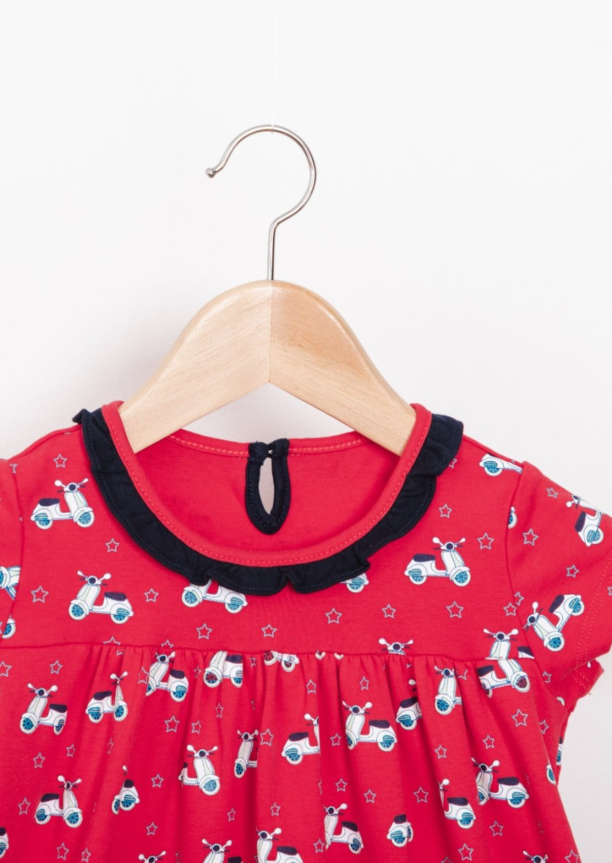 Red scooter-themed empire dresses with star-lined pockets, tailored from premium cotton.