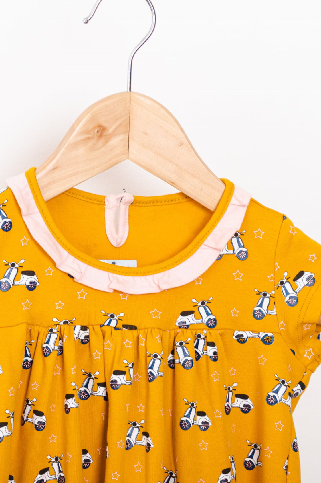 Vespa Yellow Dress with fine ruffled collar. Featuring playful scooter and star prints.