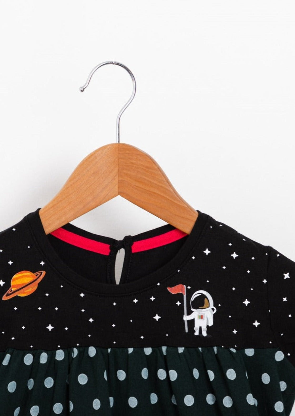 Astro Dress in green color. Features a starry background with charming astronaut and Saturn details on the upper front